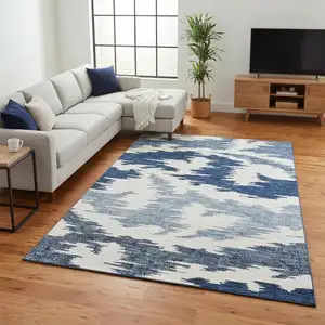 Photo of Navy Blue And Ivory Abstract Washable Area Rug With UV Protection