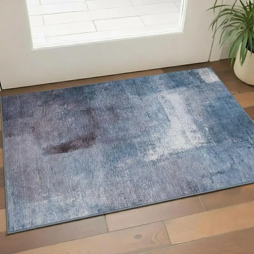 Navy Blue And Ivory Abstract Washable Area Rug With UV Protection Photo 1