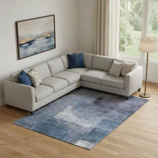 Navy Blue And Ivory Abstract Washable Area Rug With UV Protection Photo 1