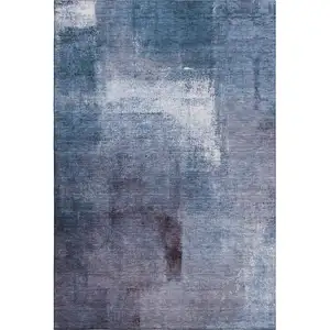 Photo of Navy Blue And Ivory Abstract Washable Area Rug With UV Protection