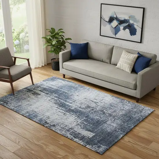 Navy Blue And Ivory Abstract Washable Area Rug With UV Protection Photo 1