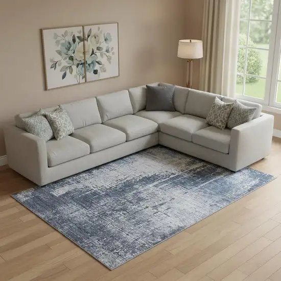 Navy Blue And Ivory Abstract Washable Area Rug With UV Protection Photo 1