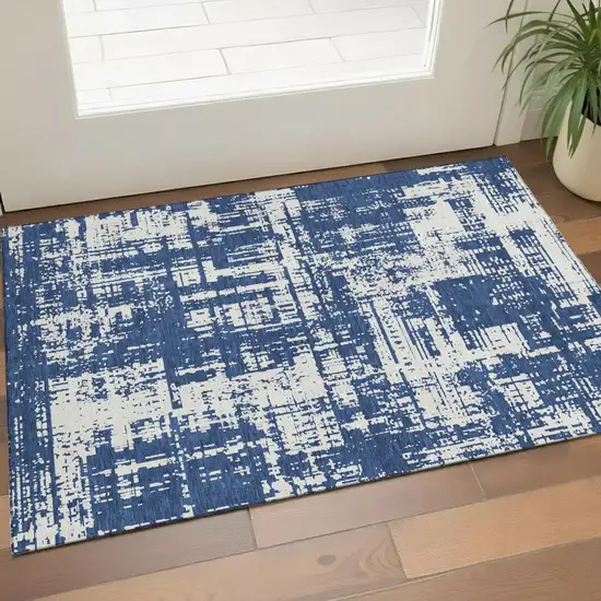 Navy Blue And Ivory Abstract Washable Area Rug With UV Protection Photo 1
