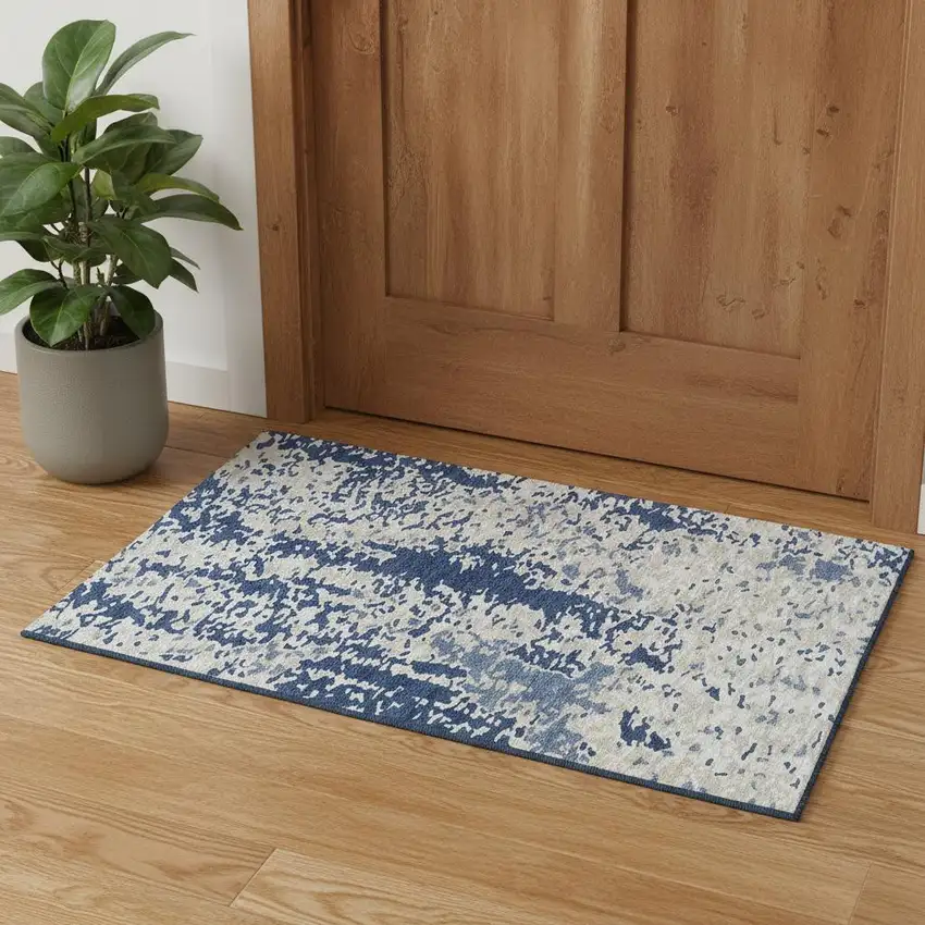 Navy Blue And Ivory Abstract Washable Area Rug With UV Protection Photo 1