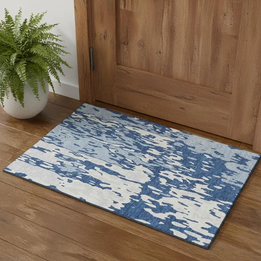 Navy Blue And Ivory Abstract Washable Area Rug With UV Protection Photo 1