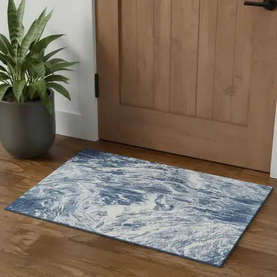 Navy Blue And Ivory Abstract Washable Area Rug With UV Protection Photo 1