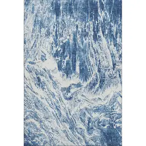 Photo of Navy Blue And Ivory Abstract Washable Area Rug With UV Protection