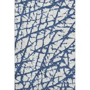 Photo of Navy Blue And Ivory Abstract Washable Area Rug With UV Protection