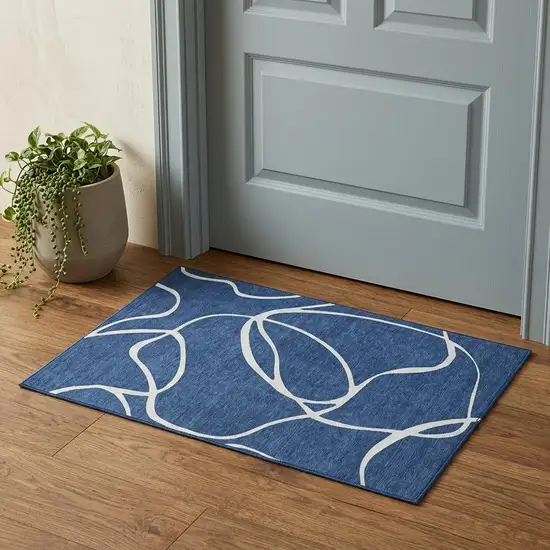 Navy Blue And Ivory Abstract Washable Area Rug With UV Protection Photo 1