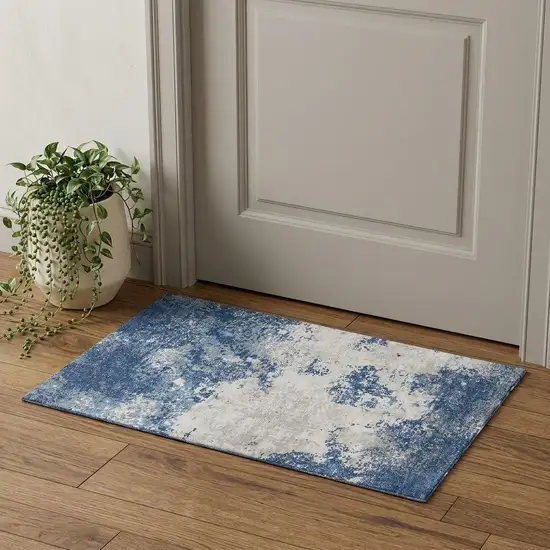 Navy Blue And Ivory Abstract Washable Area Rug With UV Protection Photo 1