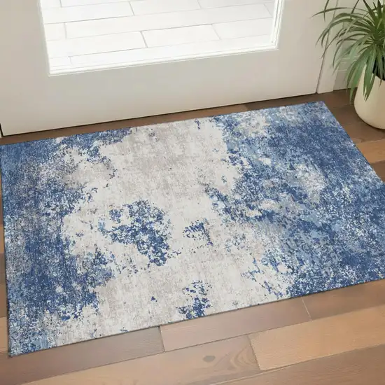 Navy Blue And Ivory Abstract Washable Area Rug With UV Protection Photo 1