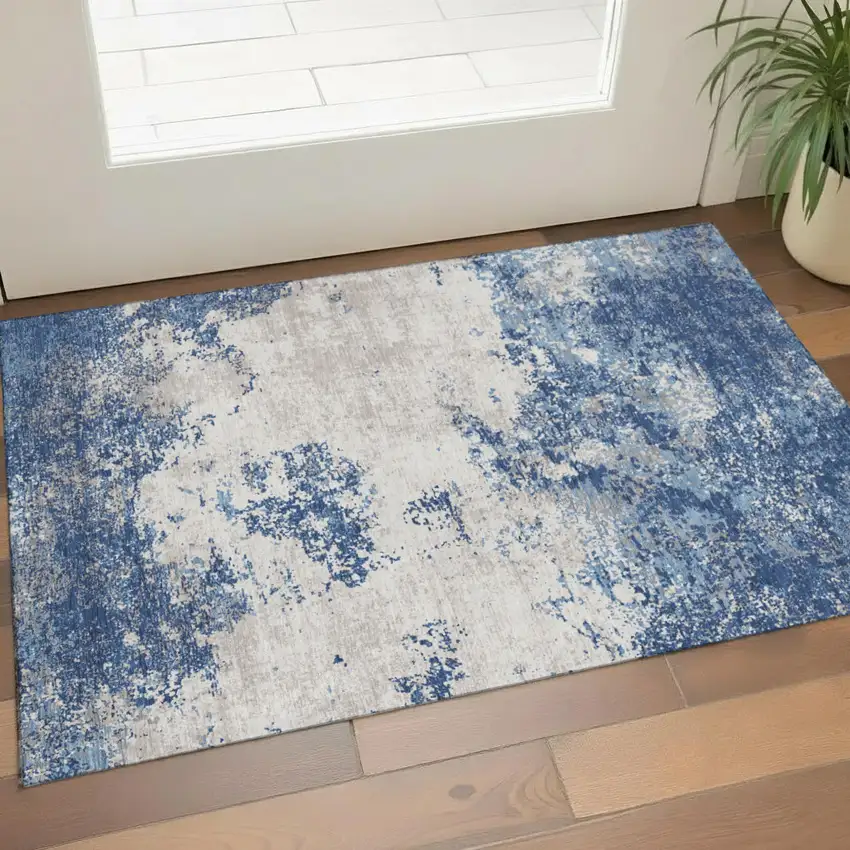 Navy Blue And Ivory Abstract Washable Area Rug With UV Protection Photo 1