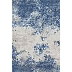 Photo of Navy Blue And Ivory Abstract Washable Area Rug With UV Protection