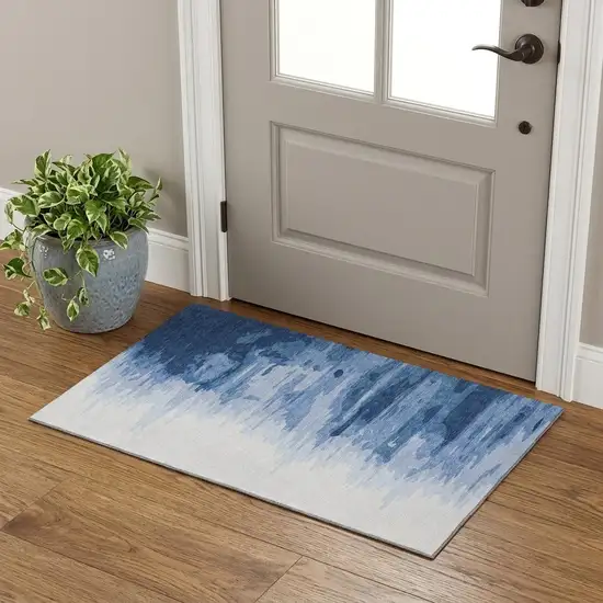 Navy Blue And Ivory Abstract Washable Area Rug With UV Protection Photo 1