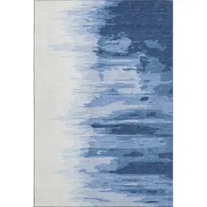 Photo of Navy Blue And Ivory Abstract Washable Area Rug With UV Protection