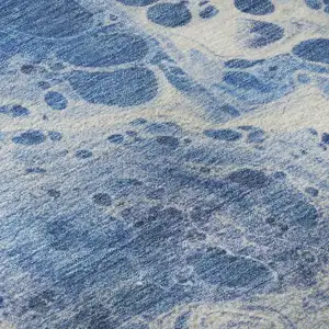 Photo of Navy Blue And Ivory Abstract Washable Area Rug With UV Protection