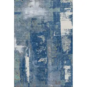 Photo of Navy Blue And Ivory Abstract Washable Area Rug With UV Protection
