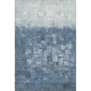 Photo of Navy Blue And Ivory Abstract Washable Area Rug With UV Protection