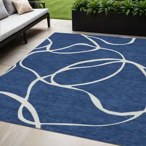 Photo of Navy Blue And Ivory Abstract Washable Indoor Outdoor Area Rug