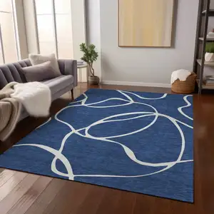 Photo of Navy Blue And Ivory Abstract Washable Indoor Outdoor Area Rug