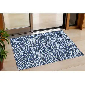 Photo of Navy Blue And Ivory Abstract Washable Indoor Outdoor Area Rug