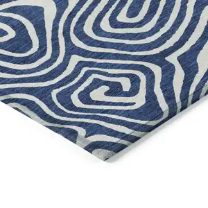 Photo of Navy Blue And Ivory Abstract Washable Indoor Outdoor Area Rug