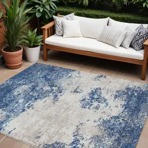 Photo of Navy Blue And Ivory Abstract Washable Indoor Outdoor Area Rug