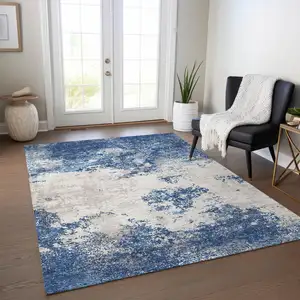 Photo of Navy Blue And Ivory Abstract Washable Indoor Outdoor Area Rug