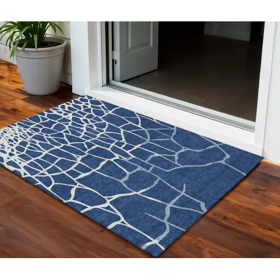 Navy Blue And Ivory Abstract Washable Indoor Outdoor Area Rug Photo 1