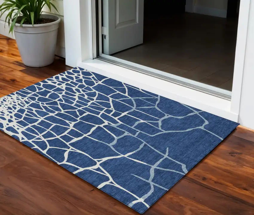 Navy Blue And Ivory Abstract Washable Indoor Outdoor Area Rug Photo 1