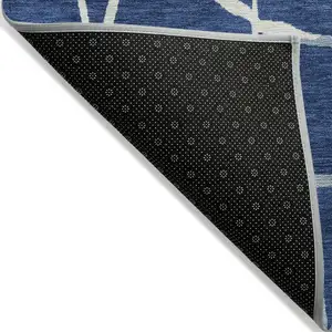 Photo of Navy Blue And Ivory Abstract Washable Indoor Outdoor Area Rug