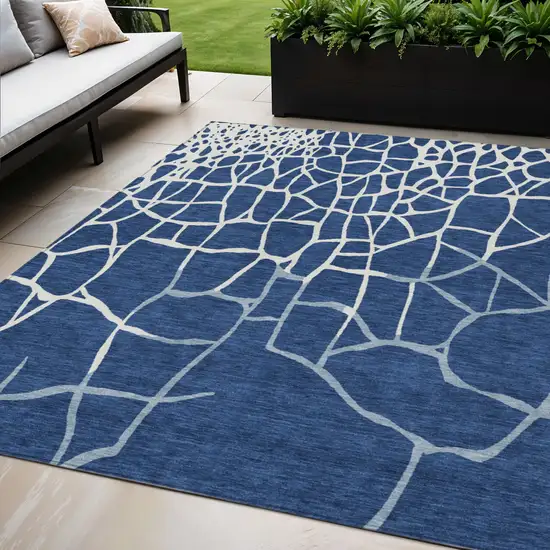 Navy Blue And Ivory Abstract Washable Indoor Outdoor Area Rug Photo 1