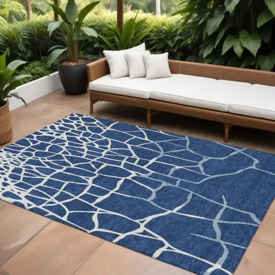 Navy Blue And Ivory Abstract Washable Indoor Outdoor Area Rug Photo 1