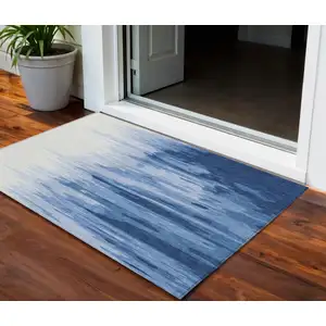 Photo of Navy Blue And Ivory Abstract Washable Indoor Outdoor Area Rug