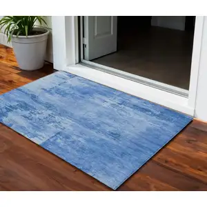 Photo of Navy Blue And Ivory Abstract Washable Indoor Outdoor Area Rug
