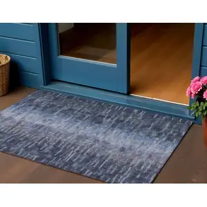 Photo of Navy Blue And Ivory Abstract Washable Indoor Outdoor Area Rug