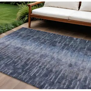Photo of Navy Blue And Ivory Abstract Washable Indoor Outdoor Area Rug