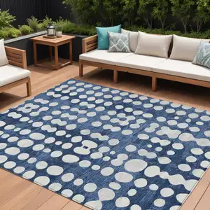 Photo of Navy Blue And Ivory Abstract Washable Indoor Outdoor Area Rug