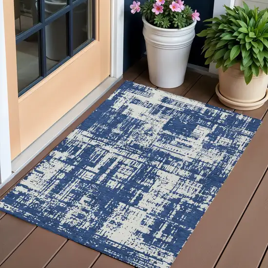 Navy Blue And Ivory Abstract Washable Indoor Outdoor Area Rug Photo 1