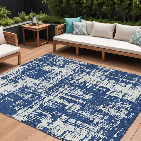 Navy Blue And Ivory Abstract Washable Indoor Outdoor Area Rug Photo 1
