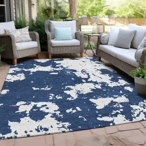 Photo of Navy Blue And Ivory Abstract Washable Indoor Outdoor Area Rug
