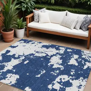 Photo of Navy Blue And Ivory Abstract Washable Indoor Outdoor Area Rug