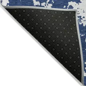 Photo of Navy Blue And Ivory Abstract Washable Indoor Outdoor Area Rug