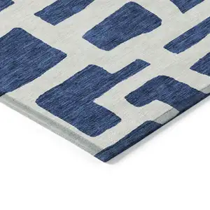 Photo of Navy Blue And Ivory Abstract Washable Indoor Outdoor Area Rug