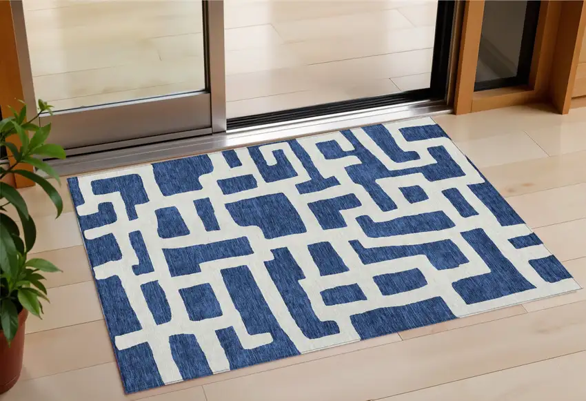 Navy Blue And Ivory Abstract Washable Indoor Outdoor Area Rug Photo 1