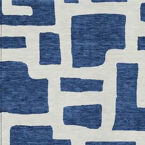 Photo of Navy Blue And Ivory Abstract Washable Indoor Outdoor Area Rug