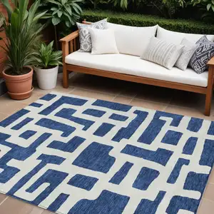 Photo of Navy Blue And Ivory Abstract Washable Indoor Outdoor Area Rug