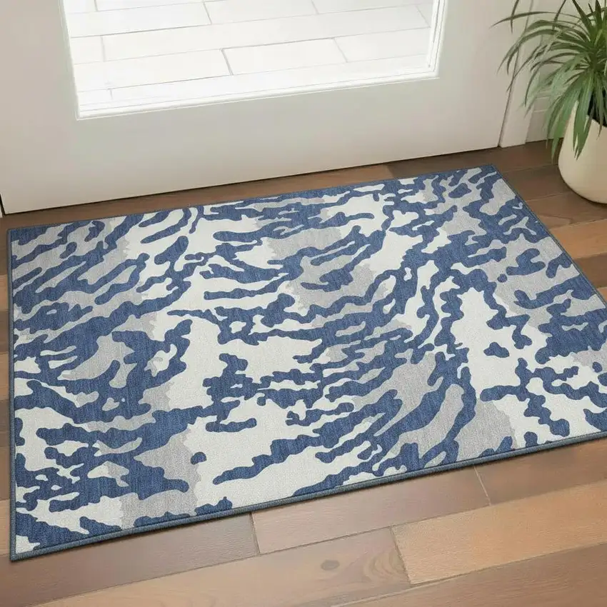 Navy Blue And Ivory Animal Print Washable Area Rug With UV Protection Photo 1