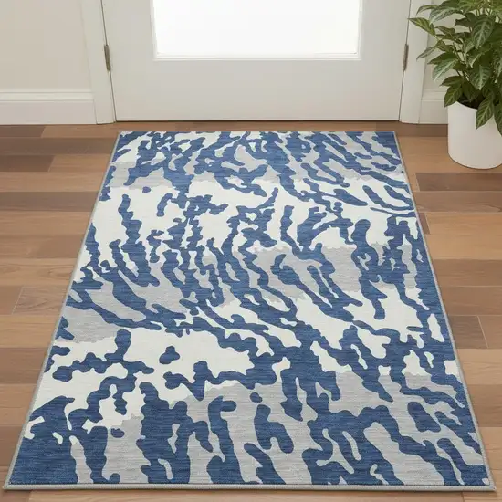 Navy Blue And Ivory Animal Print Washable Area Rug With UV Protection Photo 2