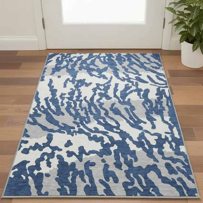 Navy Blue And Ivory Animal Print Washable Area Rug With UV Protection Photo 2